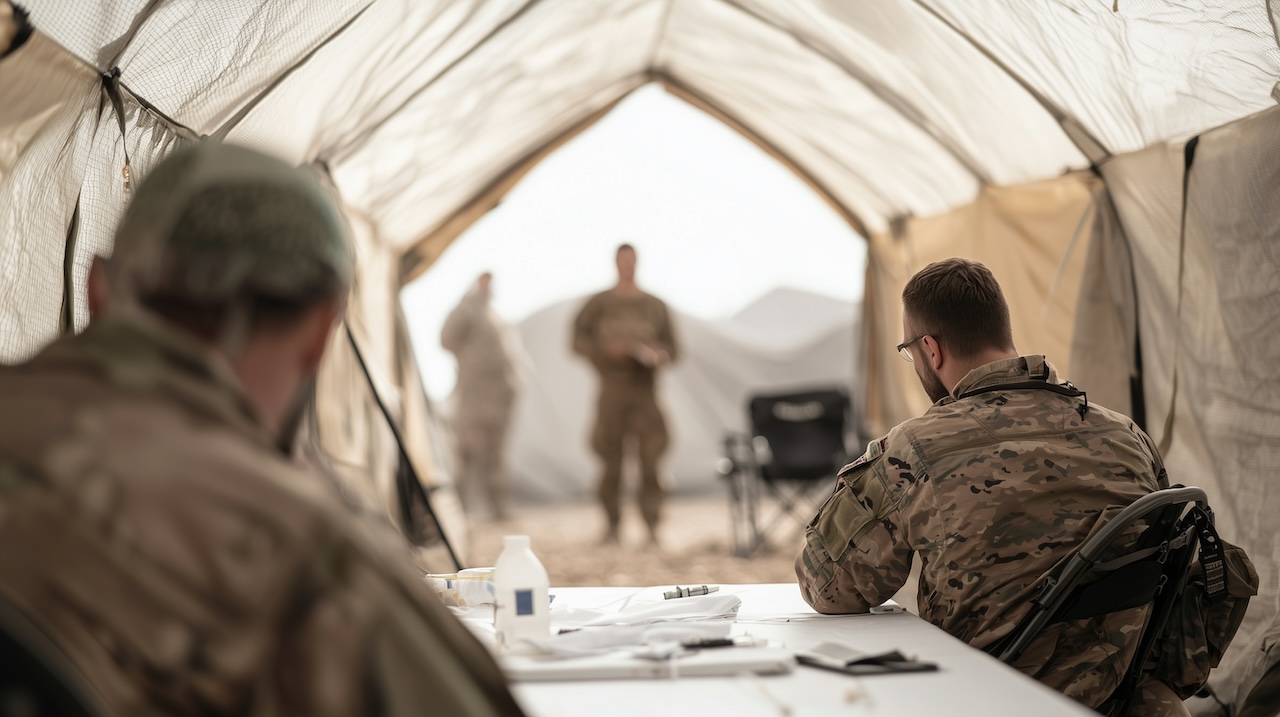 Military medical team conducting field hospital training with local civilians photo